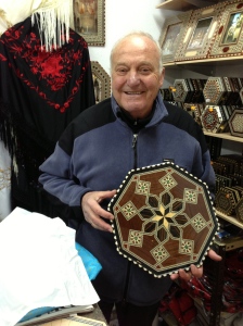 Sr. Cortez, holding my new wooden tea tray, with it's precise Moorish geometric wooden tilework.